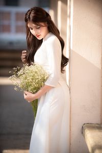 Graceful Vietnamese Girl in Pristine White Ao Dai: Timeless Beauty.-10