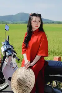 Discover the Serene Beauty: Vietnamese Girl in Red Ao Dai Amidst Green Rice Fields-2