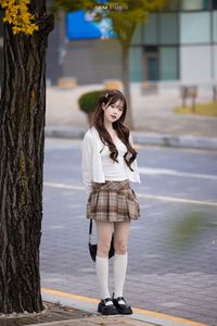 Young Asian Girl in Plaid Skirt Embracing Autumn Foliage-18