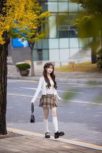 Young Asian Girl in Plaid Skirt Embracing Autumn Foliage-5