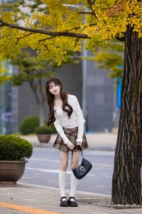 Young Asian Girl in Plaid Skirt Embracing Autumn Foliage-6