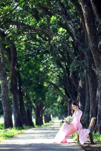 VGU No.150: Graceful Vietnamese Beauty in Pink Ao Dai on a Serene Path-0