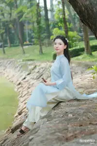 Elegant Vietnamese Maiden in Áo Dài Amidst Serene Nature's Embrace-2