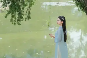 Elegant Vietnamese Maiden in Áo Dài Amidst Serene Nature's Embrace-9