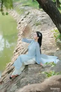 Elegant Vietnamese Maiden in Áo Dài Amidst Serene Nature's Embrace-12