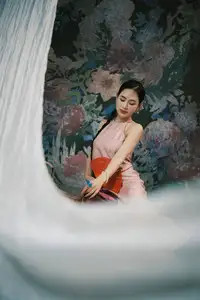 Discover Vietnamese Grace: An Elegant Girl in Ao Yem with a Red Fan.-1