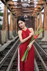 Gentle Vietnamese Girl in Red by Old Railway Bridge: Elegant Asian Beauty-5