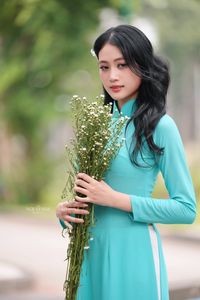Vietnamese Ao Dai Beauty: Graceful Girl with Flowers.-7