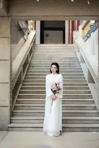 Serene Vietnamese Beauty: A Gentle Muse in White with Pink Lilies-8