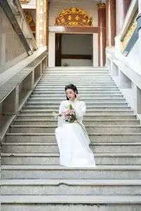 Serene Vietnamese Beauty: A Gentle Muse in White with Pink Lilies-5