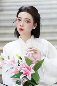 Serene Vietnamese Beauty: A Gentle Muse in White with Pink Lilies-6