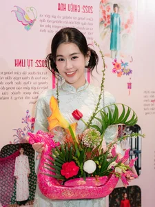 Timeless Elegance: Ngọc Thảo Radiates Grace in a Traditional Blue Vietnamese Ao Dai Amidst Artistic Heritage-4