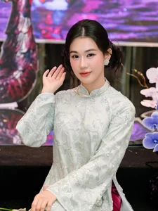 Timeless Elegance: Ngọc Thảo Radiates Grace in a Traditional Blue Vietnamese Ao Dai Amidst Artistic Heritage-2