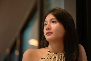 Elegant Beauty of a Young Vietnamese Girl in a Cafe Setting-1