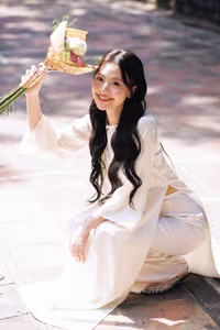 VGU No.131: Graceful young woman in traditional dress, timeless Vietnamese beauty against ancient brick.-4