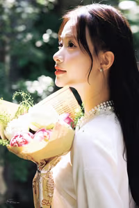 VGU No.131: Graceful young woman in traditional dress, timeless Vietnamese beauty against ancient brick.-0