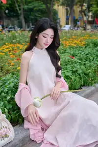 VGU No171: Vietnamese Beauty Graces a Flower Garden in Elegant Pink Ao Dai and Conical Hat-11