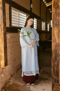 Serene Beauty: Graceful Young Woman in Traditional Attire with White Lilies-5