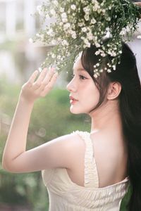 Graceful Girl in Light Yellow Dress with White Flowers, Ethereal Beauty in Nature-1