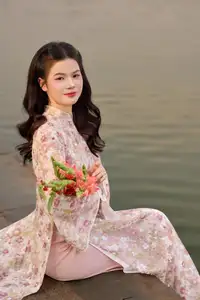 Vietnamese Ao Dai Beauty by the Lake at Sunset: Graceful Girl with Vibrant Gladiolus Flowers.-1