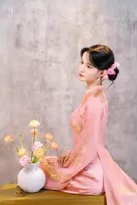 Elegant Asian Charm: Serene Young Woman in Traditional Pink Attire with Delicate Fresh Flowers-9