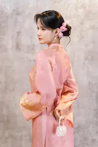 Elegant Asian Charm: Serene Young Woman in Traditional Pink Attire with Delicate Fresh Flowers-4