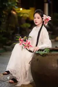 Captivating Asian Beauty: Discover the Ethereal Charm of a Maiden in White with a Blossom in Her Hair.-5