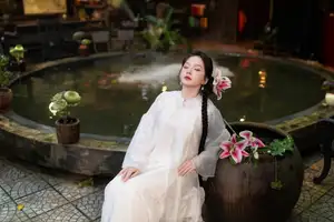 Captivating Asian Beauty: Discover the Ethereal Charm of a Maiden in White with a Blossom in Her Hair.-6