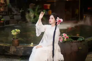 Captivating Asian Beauty: Discover the Ethereal Charm of a Maiden in White with a Blossom in Her Hair.-4