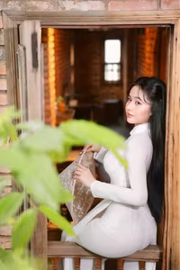 VGU No.108: Pristine White Ao Dai Elegance A Graceful Vietnamese Woman in Traditional Setting-0