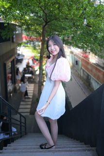Radiant smile of a young, elegant Vietnamese girl in a pink and white dress.-12