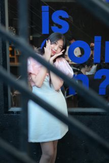 Radiant smile of a young, elegant Vietnamese girl in a pink and white dress.-5