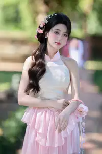 Discover the gentle charm of an Asian beauty in elegant attire, exuding grace and allure 1000025175-0