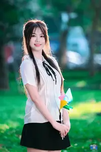 Radiant Youth: Vietnamese Girl's Bright Smile with Pinwheel in Golden Sunlight-9