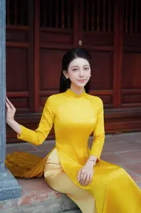 Graceful Vietnamese Beauty in Elegant Yellow Ao Dai-0