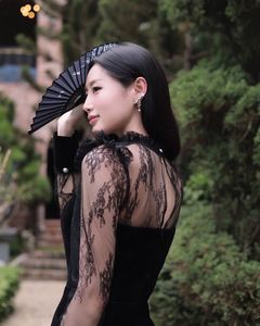 XVG No.3: Elegant Girl in Black Dress Amidst Ancient Garden Charm-0