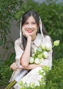 Elegant Vietnamese Woman with Pure Lotus Flowers-3