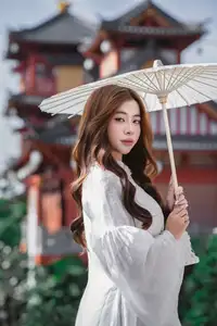 Explore Ethereal Asian Beauty: A Graceful Girl in White Ao Dai Amidst Ancient Oriental Charm-2