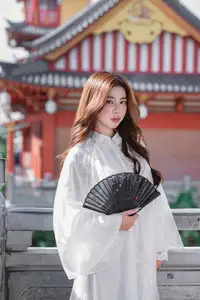 Explore Ethereal Asian Beauty: A Graceful Girl in White Ao Dai Amidst Ancient Oriental Charm-7