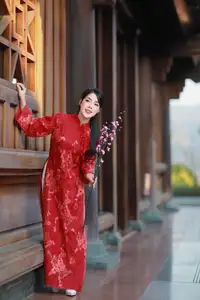 Elegant Red Ao Dai: Vietnamese Beauty with Cherry Blossoms in Ancient Architecture-3