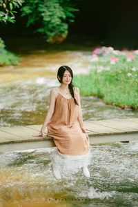 XVG No.46: Discover Natural Beauty: Young Woman in Linen Dress by a Serene Stream, a Moment of Pure Tranquility.-1