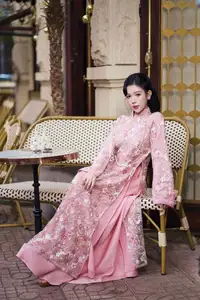 Graceful Pink Ao Dai Beauty: Elegant Vietnamese Woman with Alluring Pearl Jewelry-6