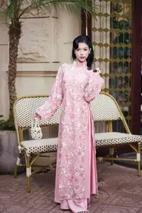 Graceful Pink Ao Dai Beauty: Elegant Vietnamese Woman with Alluring Pearl Jewelry-3