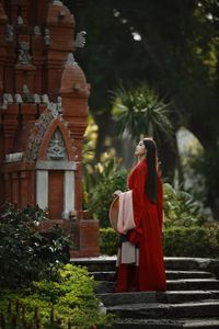 Traditional Vietnamese Beauty: Young woman with ancient instrument, immersed in culture and music.-11