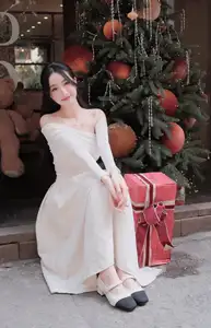 Christmas Radiance: Girl in Elegant White Dress and Joyful Smile-3