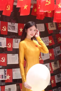 VGU No.114: Radiant Yellow Ao Dai Amidst Lotus Blooms, Embodying Vietnamese Grace-1