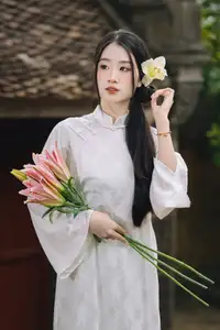 Discover the Grace of a Vietnamese Woman in White Ao Dai with Elegant Lilies-8