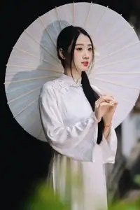 Discover the Grace of a Vietnamese Woman in White Ao Dai with Elegant Lilies-1