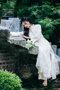 VGU No.131: Explore the Ethereal Beauty of a Vietnamese Lady in White Ao Dai with Lilies-4