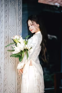 VGU No.131: Explore the Ethereal Beauty of a Vietnamese Lady in White Ao Dai with Lilies-2